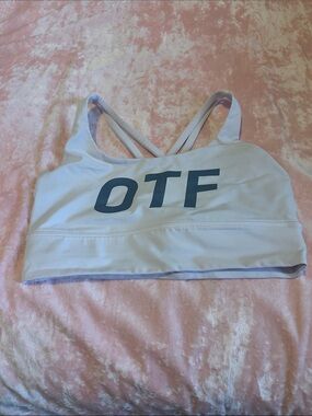 lululemon athletica pale pink sports bra with logo tag.